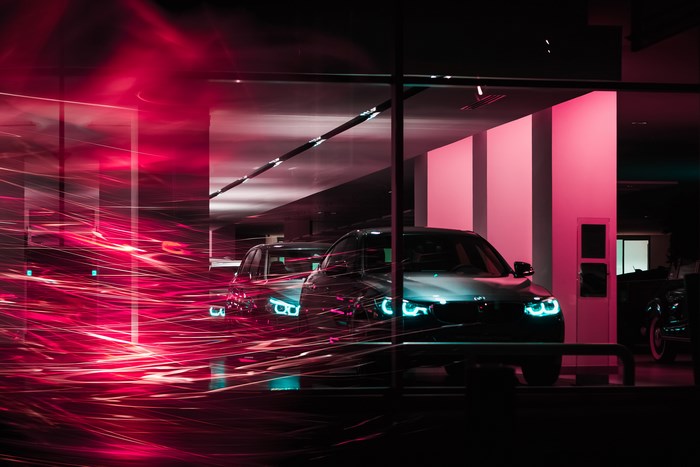 BMW cars with light trails at night