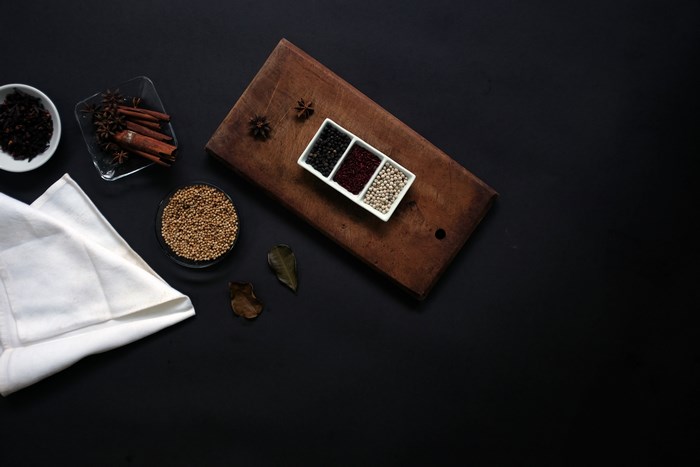 Spices and herbs on a dark background