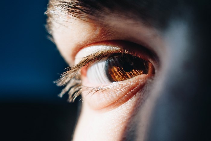 Close-up of a human eye with brown iris