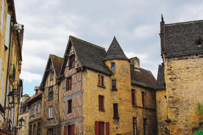 Stone buildings with medieval architecture and conical tower