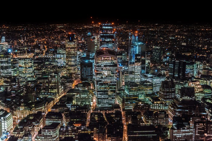 London cityscape at night with illuminated skyscrapers