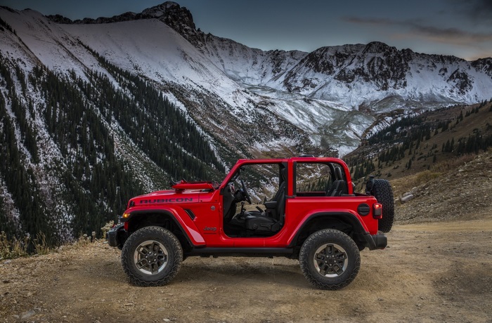 Red Jeep Wrangler Rubicon in Mountains
