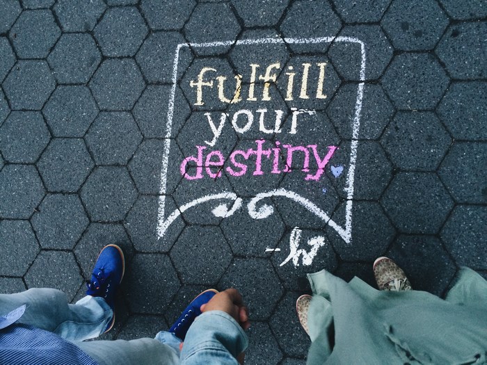 Chalk art "Fulfill Your Destiny" on New York sidewalk