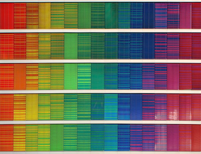 Building with rainbow colored blinds in rows