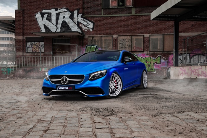 Blue Mercedes-AMG S63 Coupe with Graffiti Background