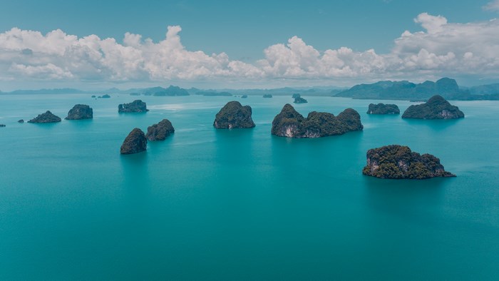 Aerial view of limestone islands in the turquoise sea of Thailand