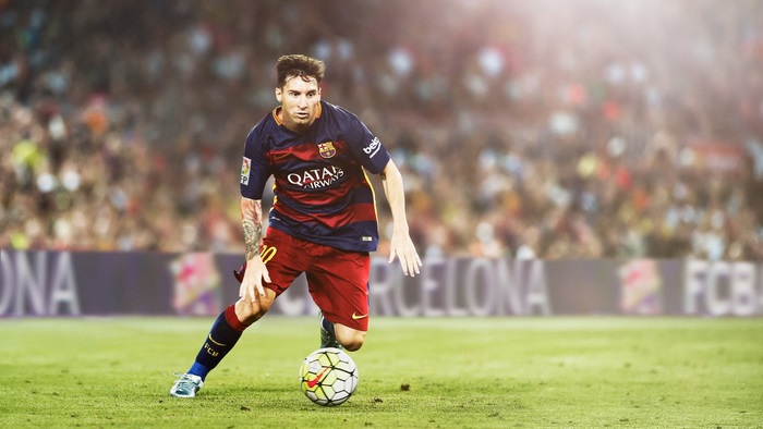 Lionel Messi playing soccer for FC Barcelona