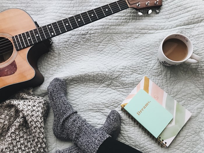 Cozy morning with guitar, coffee, and journal