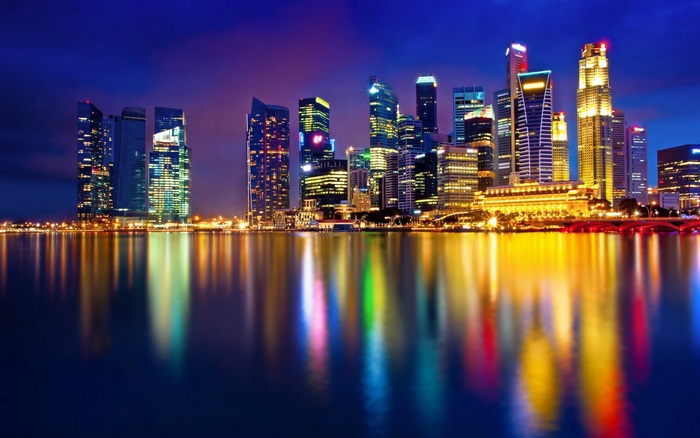 Singapore skyline at night with reflections