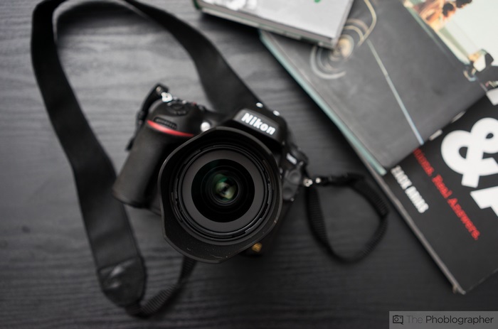 Nikon D750 camera with lens and books