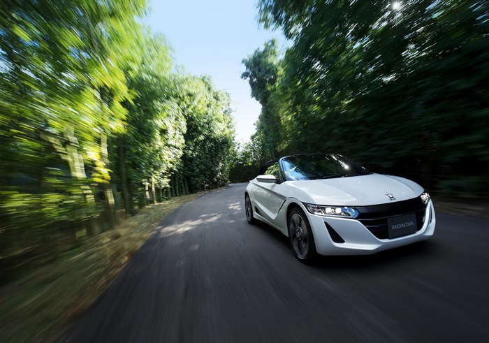 White Honda S660 Convertible Driving on Tree-Lined Road