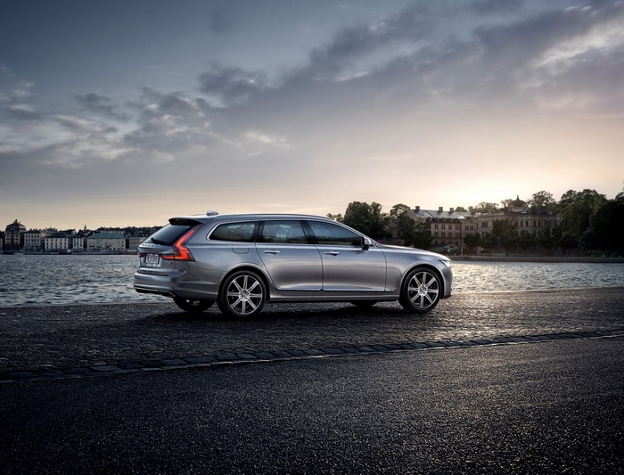 Silver Volvo V90 4K parked by water