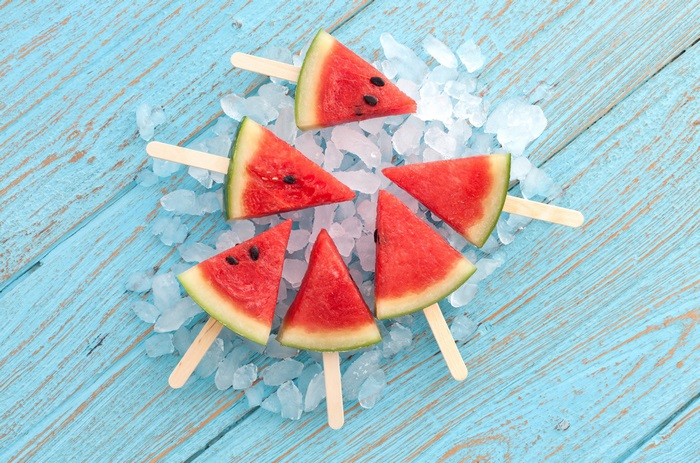 Watermelon slices on sticks with ice