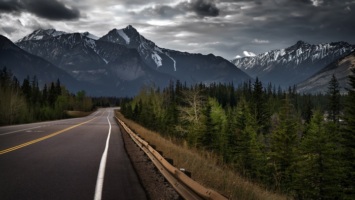 Road through mountains and forest