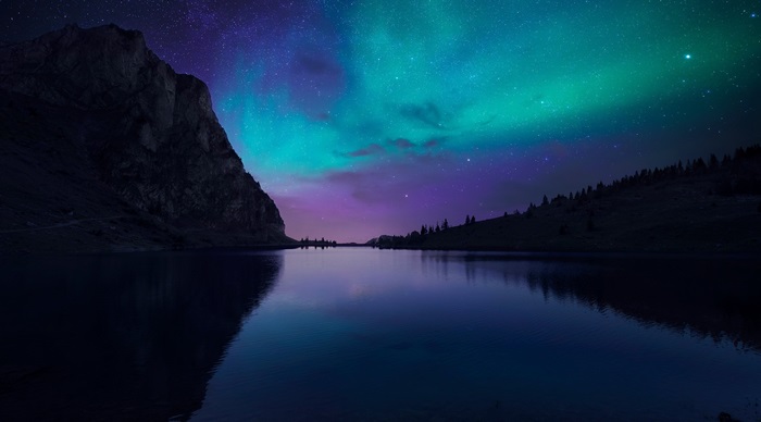 Lake and Aurora Borealis over Mountains