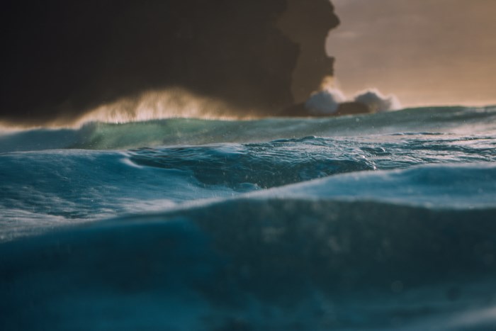 Ocean waves crashing against a rocky coastline