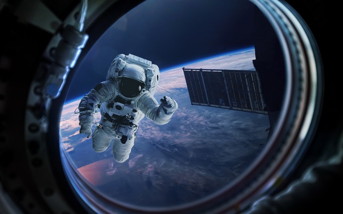 Astronaut in space with Earth below