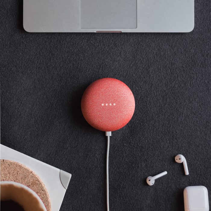 Google Home Mini with Apple AirPods and MacBook