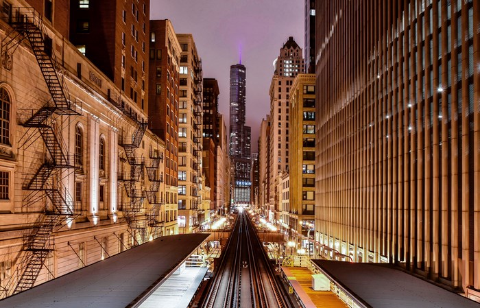 Chicago downtown at night with Trump Tower and train tracks