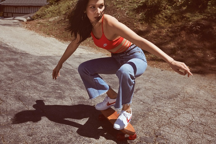Bella Hadid skateboarding in jeans and Nike top