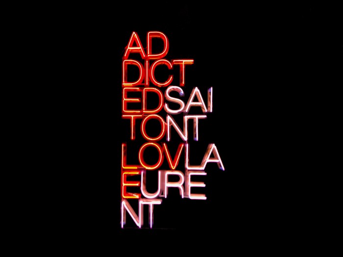 Colette neon sign with words Addiction and Love