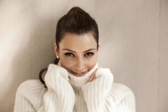 Kim Kardashian in a white turtleneck sweater