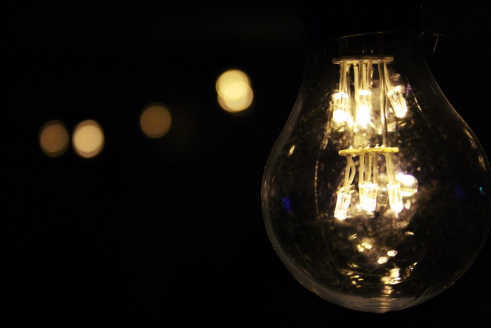 Close-up of a glowing LED filament light bulb