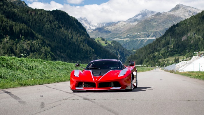Red Ferrari FXX K Evo in Mountains