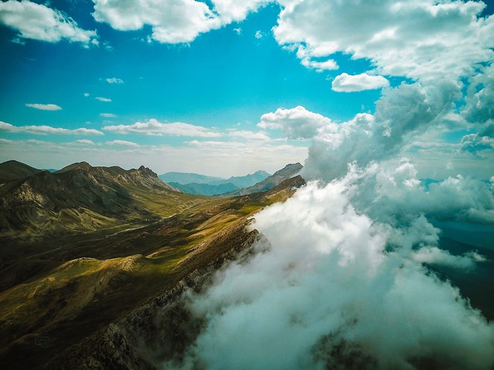 Aerial view of mountainside with clouds