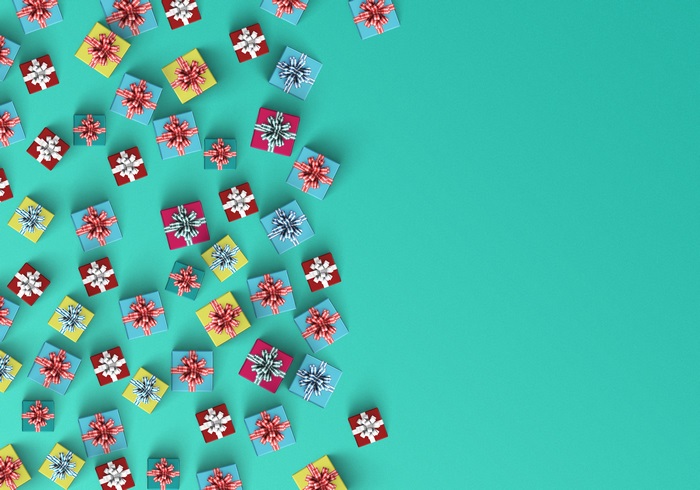 Gift boxes scattered on a teal background