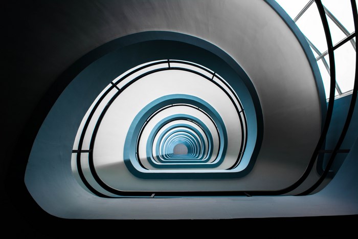 Spiral Staircase Architecture with Blue Accents