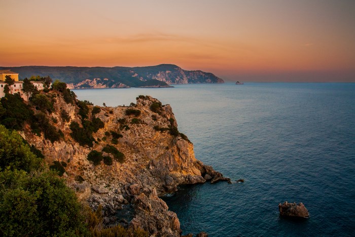 Cliff overlooking the sea at sunset in Corfu