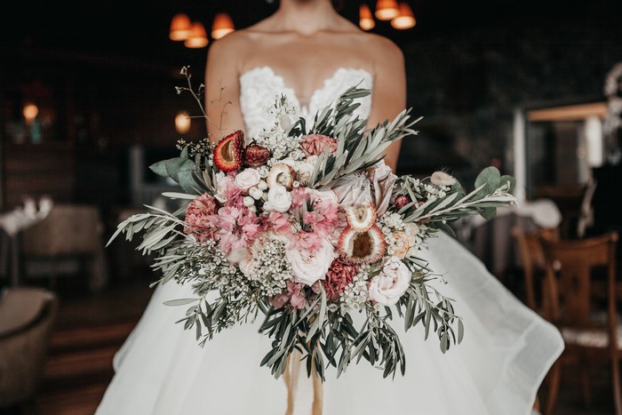 Bride holding a pink and white floral bouquet