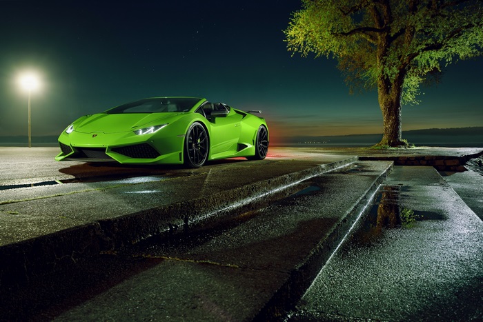 Green Lamborghini Huracan convertible at night
