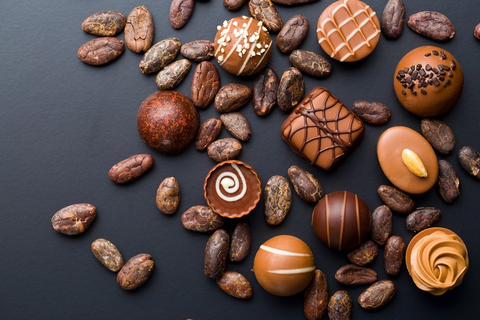 Assortment of chocolates and cocoa beans