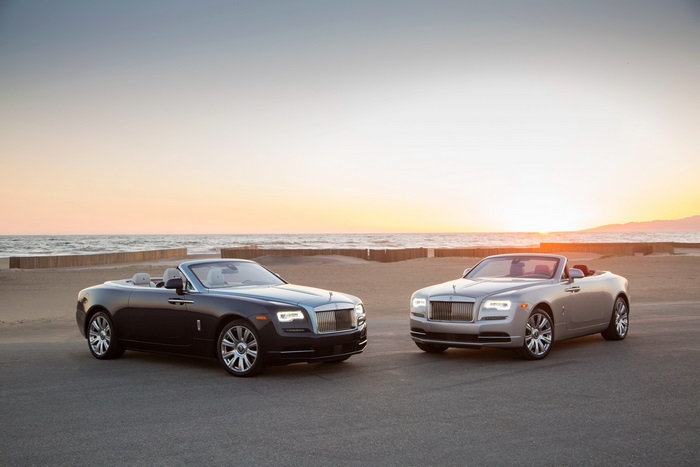 Rolls-Royce Dawn convertibles on beach at sunset