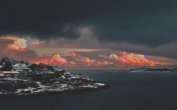 Glitch art sea landscape with houses and clouds