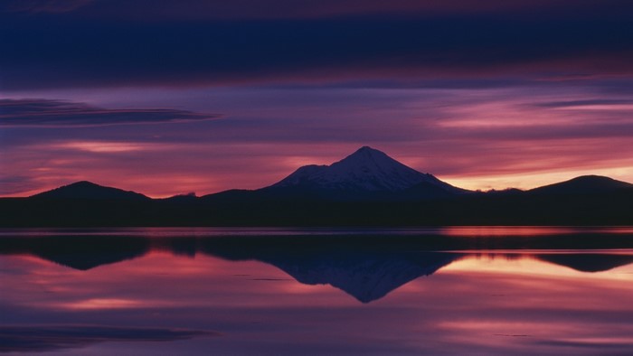 Mountain reflection at sunset over a lake