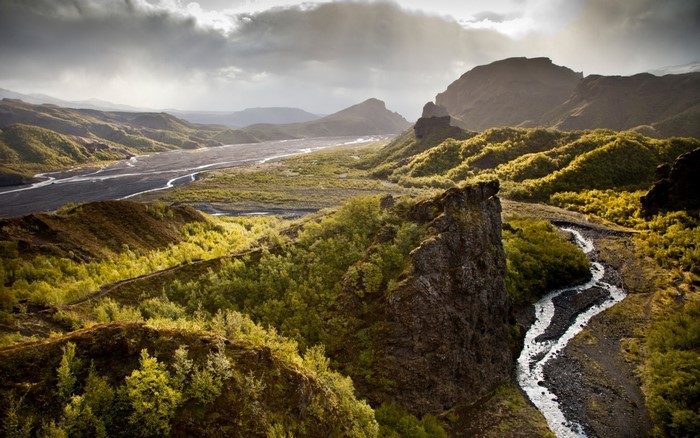 River valley with hills and forests in Iceland