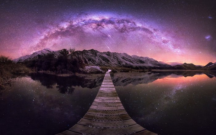 Milky Way over Mountains and Lake with Wooden Walkway