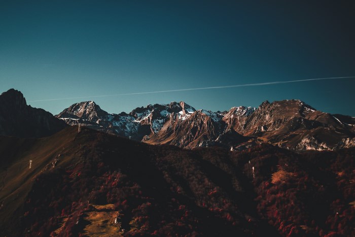 Snow-capped mountains in Asturia, Spain under a clear sky