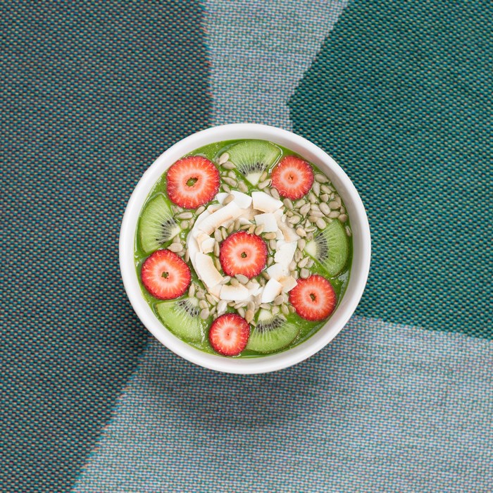 Healthy smoothie bowl with strawberries and kiwi