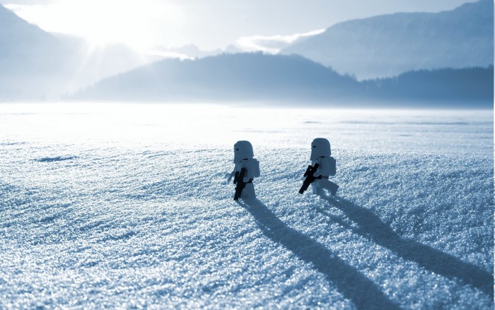 Two Lego Star Wars stormtroopers walking on snow
