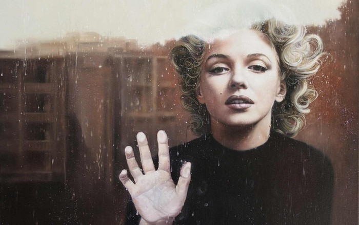 Marilyn Monroe behind a rainy window