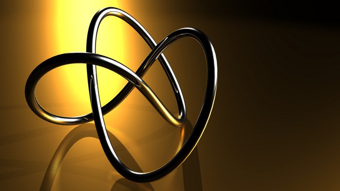 Abstract metallic knot with yellow and brown background