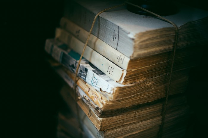 Stack of old books tied with twine