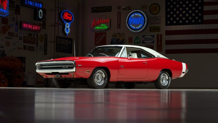 Red Dodge Charger with vintage signs