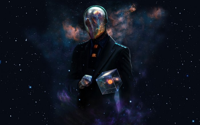 Man with galaxy head holding a cube in space
