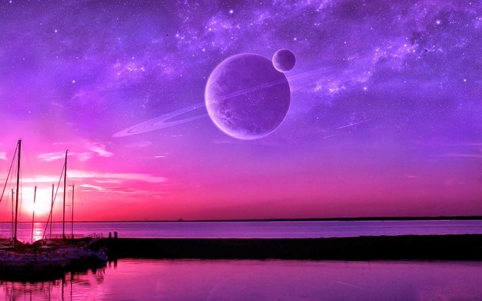Planets with rings over a harbor at sunset