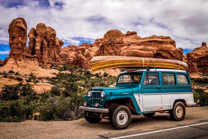 Vintage Jeep with Canoe in Arches National Park, Utah